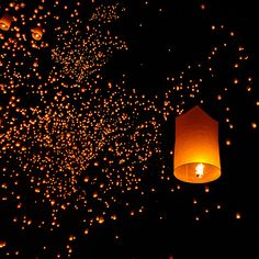 lanterns floating in the air at night