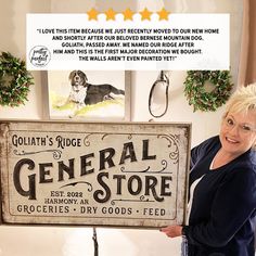 a woman standing next to a sign that says general store