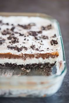 a close up of a dessert in a glass dish on a table with chocolate chips