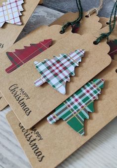 four tags with christmas tree designs on them