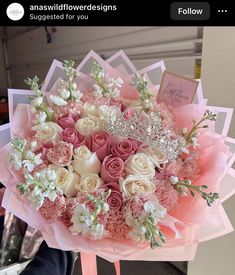 a pink and white bouquet with flowers in it