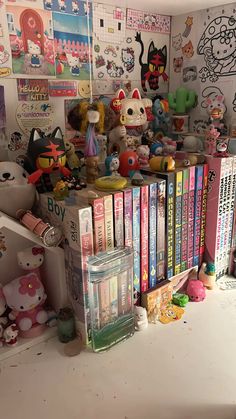 there are many books and toys on the shelf in this room, all stacked up together