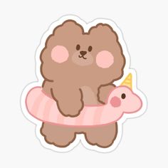 a brown teddy bear sitting on top of a pink piggy sticker with a party hat