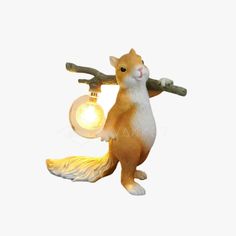 a squirrel lamp with a light bulb on it's back and its tail hanging down