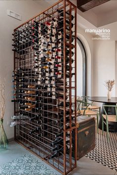 the wine rack is filled with many bottles