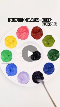 a paint palette filled with different colors of watercolors and the words purple black deep purple