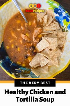 the very best healthy chicken and tortilla soup is on this plate with chips