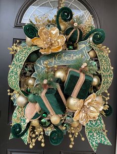 a christmas wreath with green and gold decorations