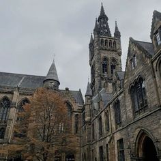 an old building with many windows and towers