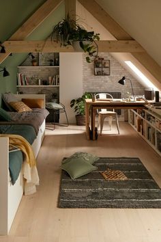 an attic bedroom with wooden floors and green walls, is featured in this ad for the magazine amenager une piece 2 en 1