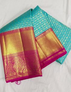 three blue and gold banaram sarees laying on top of each other in front of a white background