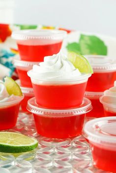 red cups filled with whipped cream and limes