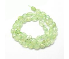 green glass beads on a white background