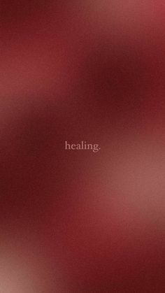 blurry image with the words'healing'written in white on red background