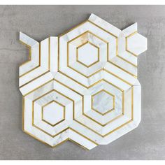 a marble and gold hexagonal wall decoration