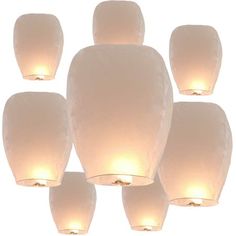 a group of white paper lanterns hanging from the ceiling