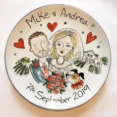 a plate with a drawing of a bride and groom on it that says mike & amanda