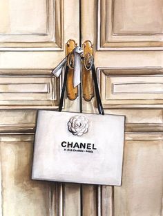 a painting of a chanel bag hanging on a door