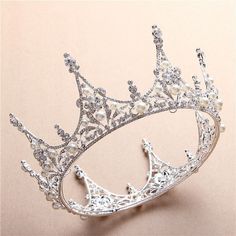 a tiara with pearls and diamonds on it