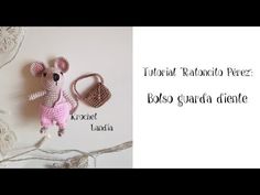 a crocheted mouse and purse sitting next to each other