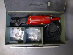 an open tool box with tools in it