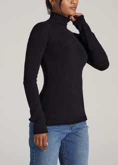 About Our Sweater for Tall Women You’ll want to cozy up by the fireside in our extra-soft, ultra-chic women’s tall mock turtleneck. When the weather gets chillier, the last thing you want are sleeves that don’t fit your frame. We designed this sweater to be the ultimate stylish addition to your fall or winter wardrobe. It offers a modern take on the traditional turtleneck, with a rolled mock neck that ends halfway up the neck instead of all the way to your chin. This extra-long sleeve sweater ha Winter High Neck Black Tops, Extra Long Sleeve Sweater, Extra Long Sleeves, Sweater Fits, Mock Turtleneck, Cozy Knit, Rolled Hem, Tall Women, Mock Neck Sweater