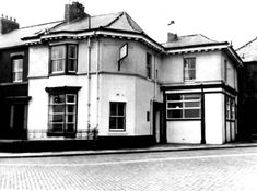 an old black and white photo of a building