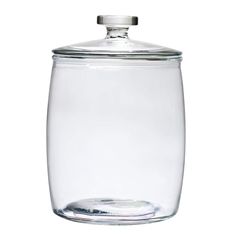 a clear glass jar with a metal lid on a white background for use as a storage container