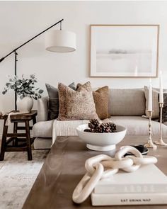 a living room filled with lots of furniture and decor on top of a wooden table