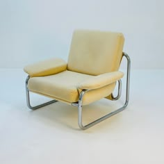 a chair that is sitting on a white surface