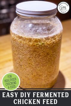 an easy diy fermented chicken feed in a mason jar