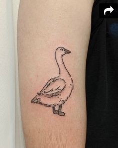 a goose tattoo on the left arm