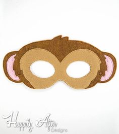 a brown monkey mask with pink ears