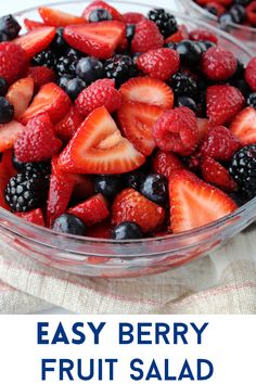 fresh fruit salad in a glass bowl with the words easy berry fruit salad on top