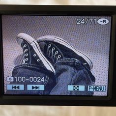 an image of someone's shoes on the tv screen