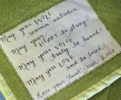 a close up of a piece of cloth with writing on it and a handwritten note