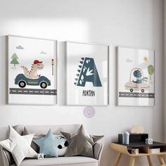 three children's art prints hang on the wall above a couch in a child's room