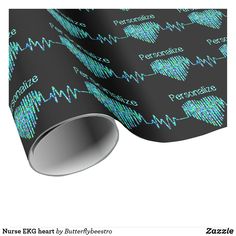 a black background with blue and green heartbeats wrapping paper on it's side