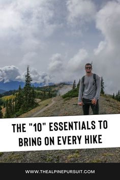 a man standing on top of a mountain with the words the 10 essentials to bring on every hike