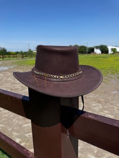 Elevate your look with our Australian Stylish Leather Cowboy Hat, a perfect blend of rugged durability and timeless elegance. Handcrafted from genuine cowhide leather, this hat embodies the classic Western spirit with a touch of Australian flair. Key Features: - **Premium Cowhide Leather Made from high-quality genuine cowhide, this hat is designed to withstand the elements while providing a soft, luxurious feel. - **Vintage Brown Finish The rich, vintage brown color enhances the hat's classic We Leather Brimmed Hats For Western-themed Events, Brimmed Leather Hats For Western-themed Events, Rustic Leather Hat Bands For Rodeo, Classic Leather Hats For Country Events, Brown High Crown Hat Band For Country Events, Brown High Crown Hat Bands For Country Events, Brown High Crown Country Hat, High Crown Brown Country Hat, Western Leather Hat Bands For Hunting