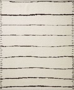 a white rug with black lines on it