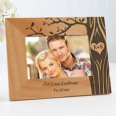 a personalized wooden frame with a couple's photo on it