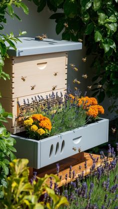 a beehive filled with lots of flowers and plants