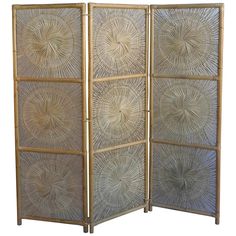 an image of a room divider made out of wood and bamboo sticks with circular designs on the sides