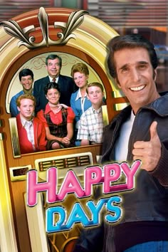 a man giving the thumbs up while standing in front of a sign that says happy days