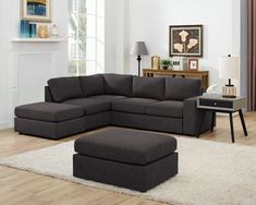 a living room with a sectional couch and ottoman