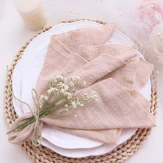 napkins and flowers on a wicker place setting