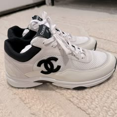 Brand New Chanel White With Black Cc Coco Mark Trainer Sneakers Chanel White Black Leather Cc Logo Runner New With Box Mesh, Suede Calfskin & Grained Calfskin Lace Up Tie Front Chanel Black Cc Side Logo White Suede Calfskin And White Calfskin Material Large Cc Bottom Logo Size 41, Fits A Us 10-10.5 Sold Out In Stores Chanel Sneakers Outfit, Chanel Tennis Shoes, Chanel Trainers, Chanel 2023, Black Bratz Doll, Trainers Outfit, Chanel Sneakers, Chanel White, Nike Fashion Shoes