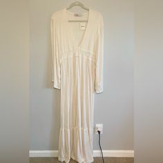 Free People Beach Dress Color Is Cream With Heathered Texture Never Worn With Tags Size Small 65% Polyester 35% Rayon Runs Long Deep V Neck Wide Sleeves Very Boho Chic! Spring V-neck Beach Dress, Cream Long Sleeve Beach Cover-up Dress, Chic V-neck Beach Dress For Loungewear, Chic V-neck Beach Dress, Casual Long Sleeve Beach Dress For Loungewear, Long Sleeve Dresses For Beach Loungewear, Flowy Cream Maxi Dress For Vacation, White V-neck Maxi Dress For Loungewear, White Flowy Maxi Dress For Loungewear