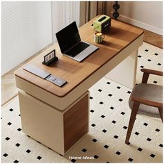 an open laptop computer sitting on top of a wooden desk next to a brown chair